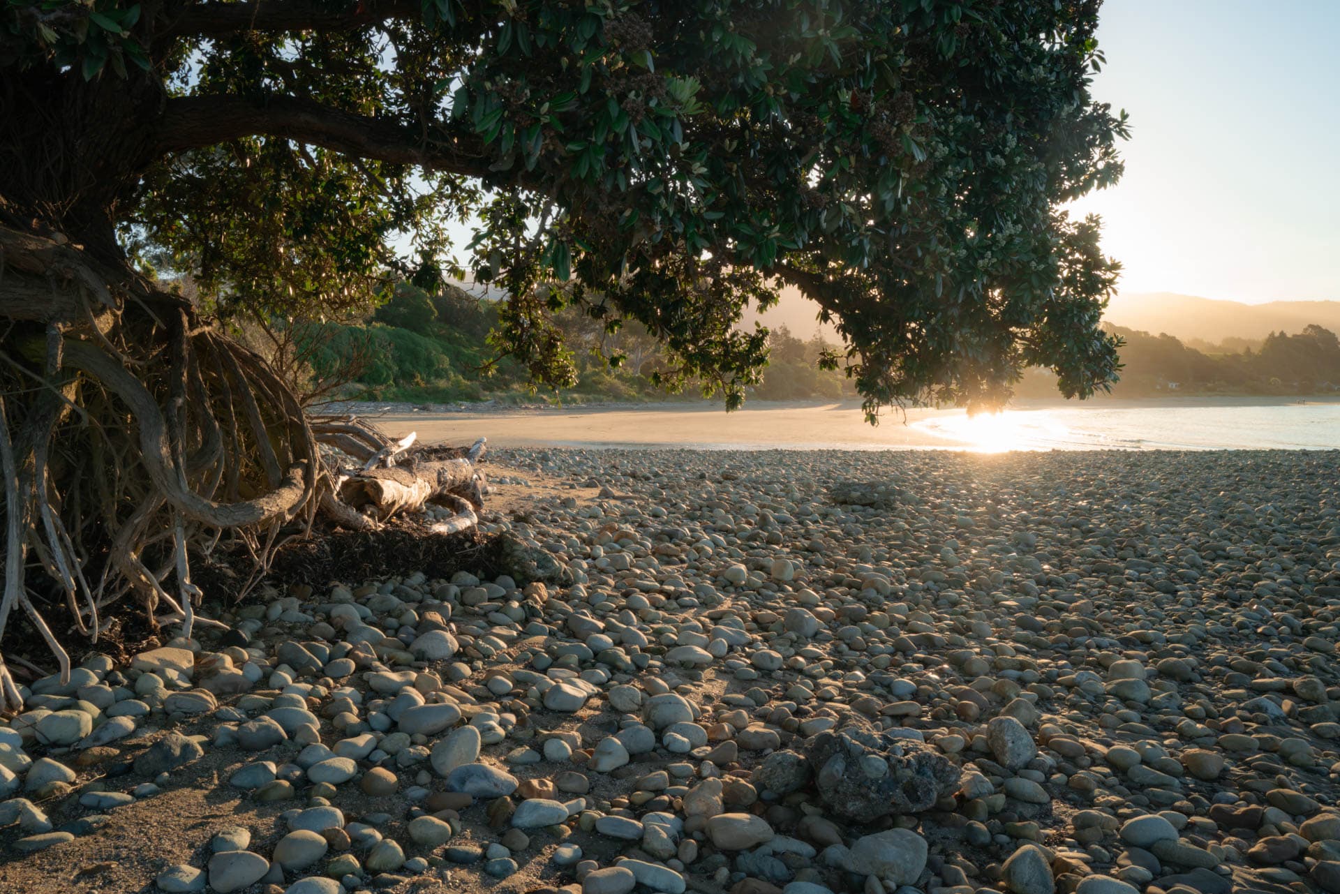 Evening light on the stones and coastline at Patons Rock near Ruru Retreat in Golden Bay